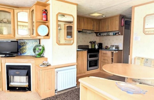 Bryn-crug House | Peaceful, woodland caravan site with pool and bar