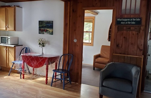 Eagle River Cottage | Private beach and pier at this cozy lakefront cottage in a quiet bay.5 lake.