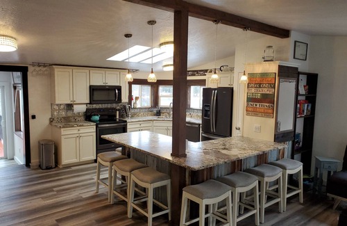 Priest River House | Private Cove River Home with water toys, 200 foot sandy beach and boat dock.