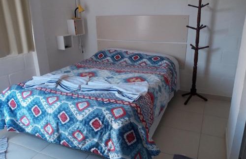 Sao Bento do Sapucai Apartment | Quarto Aconchegante