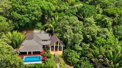 Gibson Bight House | Relax At This Hillside Retreat That Overlooks The Lush Forest And The Caribbean,