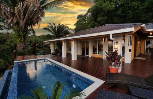 Gibson Bight House | Relax At This Hillside Retreat That Overlooks The Lush Forest And The Caribbean,