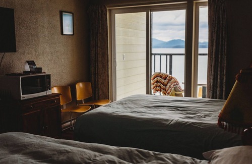 Sointula House | Room 206- Oceanfront room with balcony and two queen beds.