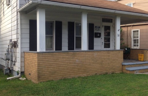 Binghamton House | Room with TV,desktop,closet,bed,chest of drawers. Can sleep two comfortably.