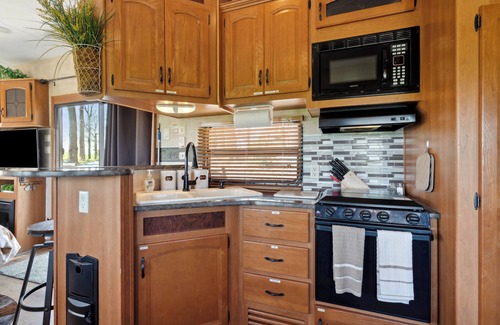 Langworthy RV Rental | Rustic Retreat Camper - on Silver Lake in Delhi. Pet Friendly!