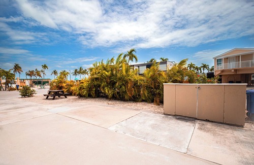 Cudjoe Key RV Rental | RV Lot 303 Venture Out, Pull-through Lot near the Ocean and Pool - Bring your golf cart!