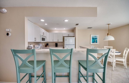 South Island House | Sand Dollar #4 - Upstairs Apt with shared Pool on Canal by the Beach!