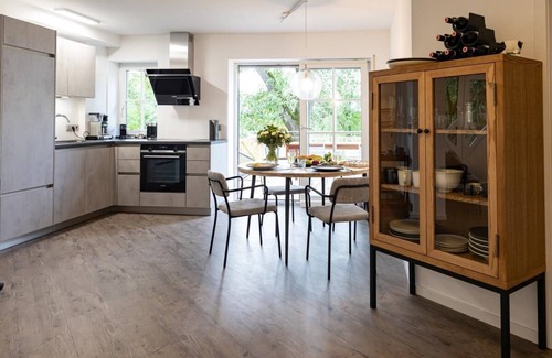 Schrozberg Apartment | Schmalfelden No. 95 with spa oasis in the living room: compact sauna, loungers and fireplace. Fenced garden with great veranda!