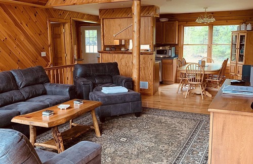 Johnsburg House | Secluded Log Cabin with hot-tub. Near Lake George. Amazing Mt View. Sleeps 15