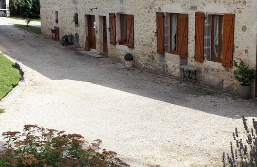 Barbaste Cottage | Semi-detached stone cottage on property with pond, bucolic setting