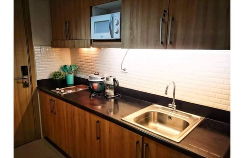 Barangay 76 House | Serenity Cove MOA Cozy condo unit amenity view.