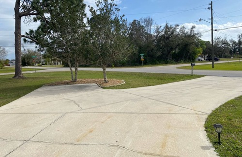 Deep Creek House | Single family, 4 bedroom, 2.5 bath, 2 car garage, lanai w/pool, outdoor shower.