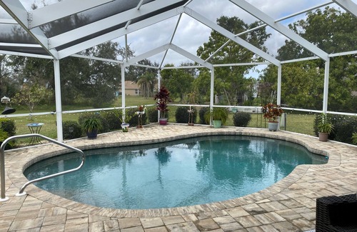 Deep Creek House | Single family, 4 bedroom, 2.5 bath, 2 car garage, lanai w/pool, outdoor shower.