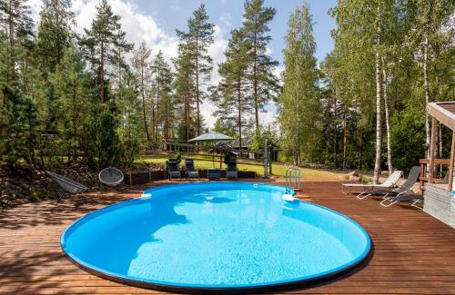 Espoo Villa | Sirpa's Artistic Nuuksio Retreat with Heated Pool