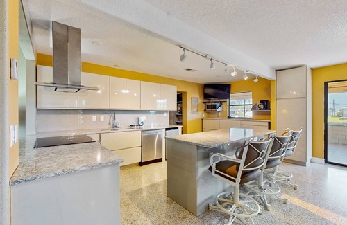 Venetian Way House | Spacious waterfront home with private pool, sunroom and dock.