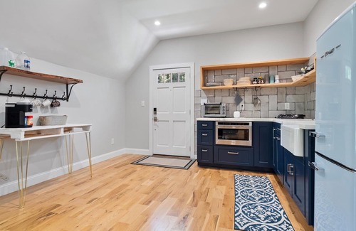 Matthews House | Studio above a detached garage away from main house on a private lot.