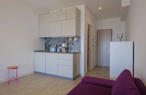Susello Apartment | Studio with sunny balcony in a residence with pool