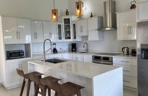 Concordia House | Stunning ocean views, spacious, open-concept, modern luxury & tropical charm.