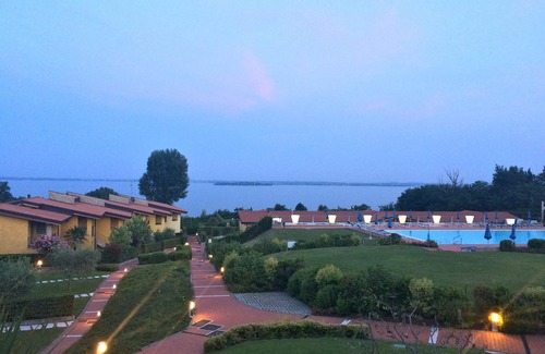Manerba del Garda Apartment | Stunning three-room lake view in a residence with three swimming pools and 36,000 m2 of greenery