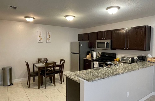 Duval House | Stylish Home in Duval w/Granite, Tile Floors, Glass Lanai & Gas Golf Cart!