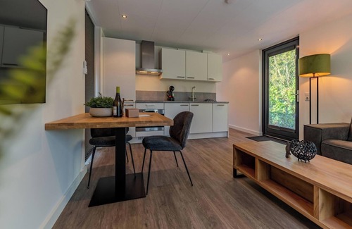 Maasbree House | Stylish two-person forest cabin with jacuzzi, set in nature with comfort, privacy and access to top-tier park facilities.