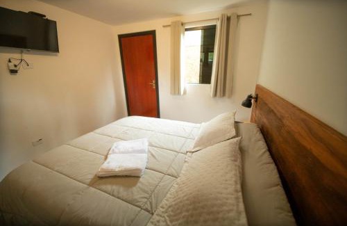 Recanto Araucaria House | Suíte jasmim rosa