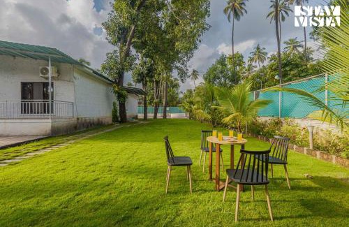 Nagaon Villa | Sundream Palms by VEO - Part of StayVista with Pool, Lawn, BBQ