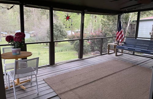 Negreet Cottage | Take a break and unwind on our waterfront screened in porch