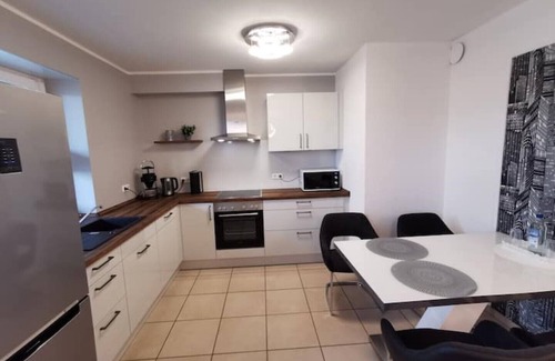 Bad Essen Apartment | The modern Welness apartment is located in Bad Essen with a view of the Wiehengebirge mountains.