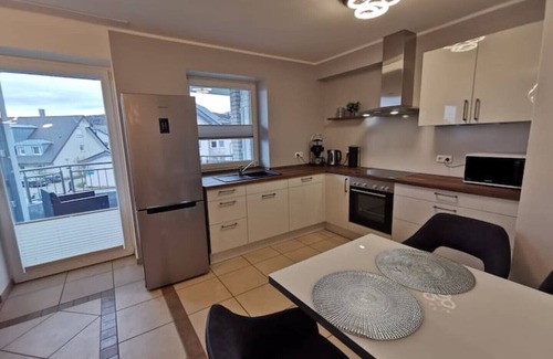 Bad Essen Apartment | The modern Welness apartment is located in Bad Essen with a view of the Wiehengebirge mountains.