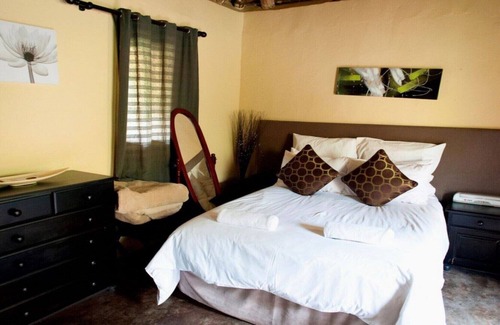 Hlotse House | The Queen-Size-Bed Riverside Huts