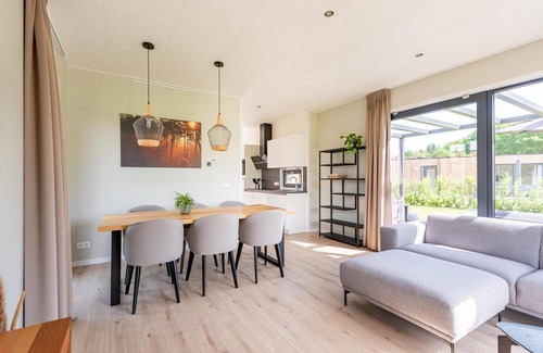 Kotten House | The six-person holiday villa Amalia with a private sauna and hot tub has a spacious living room, open kitchen, three bedrooms and a spacious patio.