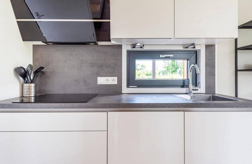 Kotten House | The six-person holiday villa Amalia with a private sauna and hot tub has a spacious living room, open kitchen, three bedrooms and a spacious patio.