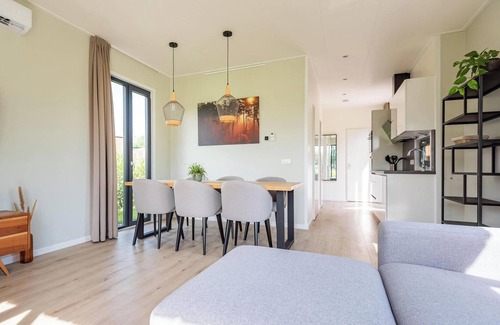 Kotten House | The six-person Parklodge 6 with Dog Fence, Sauna and Hot Tub has a spacious living room, open kitchen, three bedrooms and a spacious patio.