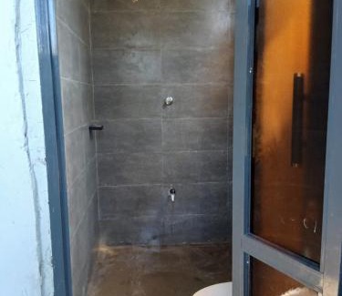 Shimoni Apartment | Tiny house, kitchen downstairs