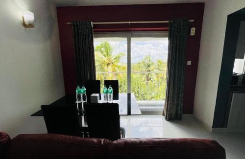Nedumbassery Apartment | Transit suites by Habitat