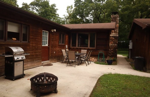 Lost River Cottage | Tree swing, Outdoor dining with Stream and Fire Pit, Large Yard, Sunroom, Trail