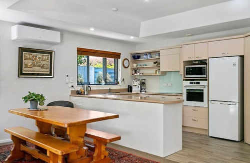 Waipahihi House | Treetop Living - peaceful oasis, serene and cozy interior, scenic views of native bush.