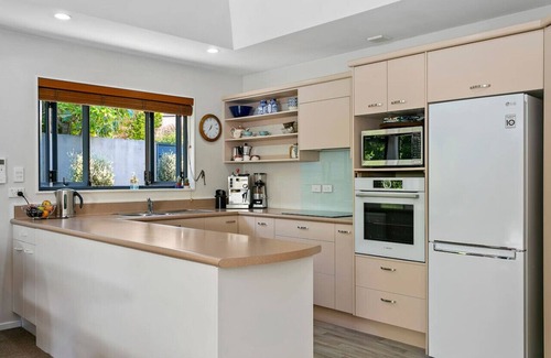 Waipahihi House | Treetop Living - peaceful oasis, serene and cozy interior, scenic views of native bush.