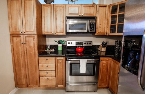 Cypress Point House | Tropical Getaway! Walking distance to beach & dining, private home, heated pool.
