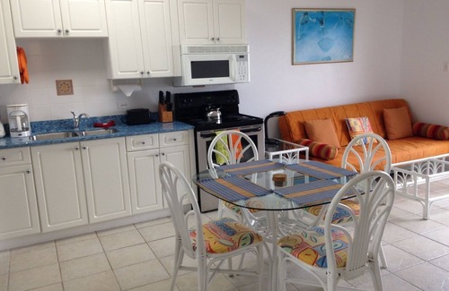 Bodden Town Apartment | Turtle Nest Inn, Prime Beachfront Apt, Rental Car Included 1399/week