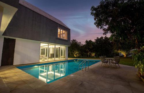 Khalapur Villa | Twilight Grove by StayVista - Pool- view villa with Manicured lawn, Contemporary interiors & Home theatre