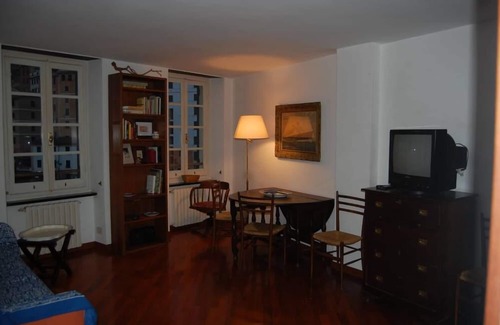 Camogli Apartment | Two windows of the fishing harbor