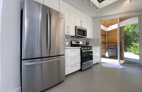 Winding Bay House | ULTRA LUX Coconut Cove Compound! 2.5 acres with 300 ft PINK SAND BEACH