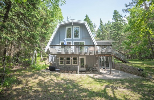 Bigfork Cabin | Unique modified A-frame cabin with loft, sandy lakefront, and amenities of home.