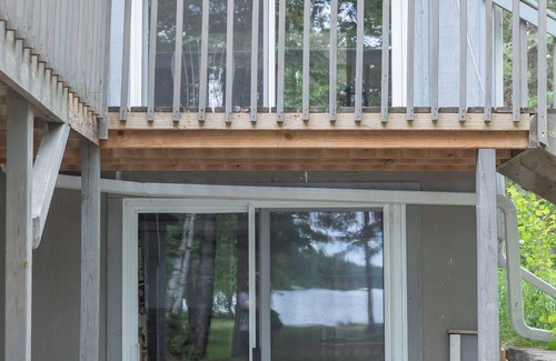 Bigfork Cabin | Unique modified A-frame cabin with loft, sandy lakefront, and amenities of home.