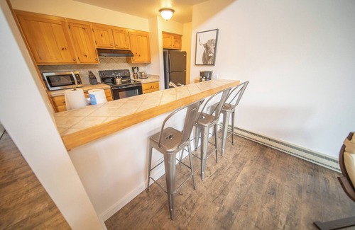 Lakeside Village Condo | Unit with wood burning fireplace and free shuttle