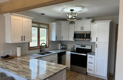 Harbor Springs Condo | Updated Phase 2 Hideaway Valley Condo Nestled in the Woods