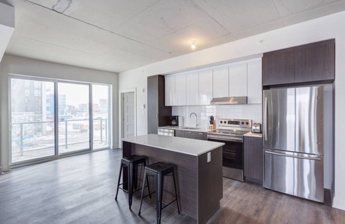 Laval Apartment | Urban 2BR Escape In-suite Laundry and Terrace