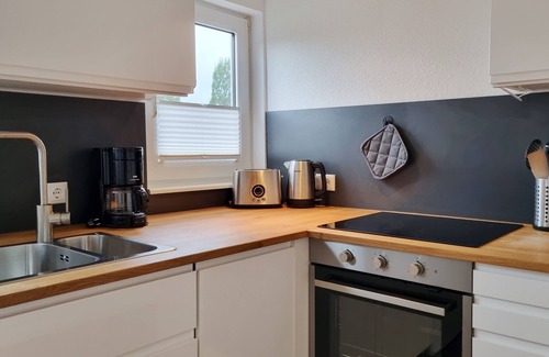 Kalifornien Apartment | Vacation apartment "Achtern Diek 3" 1st row on the Baltic Sea coast, dog-friendly